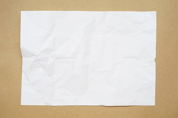 istock crumble white paper on grunge brown paper texture 520621546