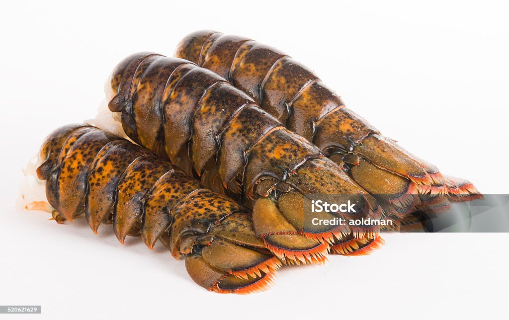 Lobster tails Four lobster tails arranged in the line Lobster - Animal Stock Photo