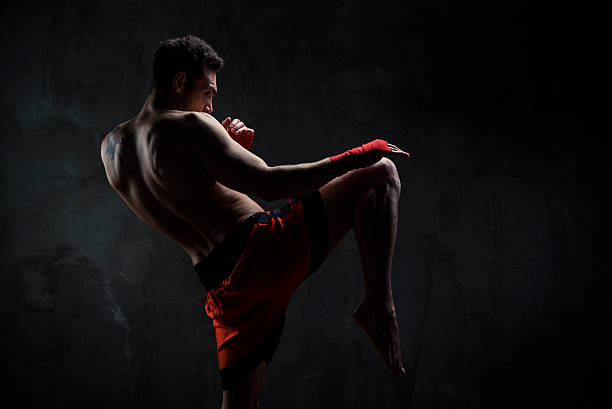 Martial arts Young man training martial arts combat sport stock pictures, royalty-free photos & images