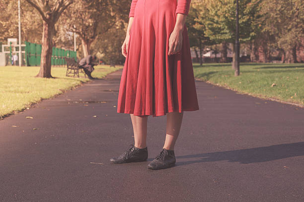 istock Young woman walking in the park 520622301