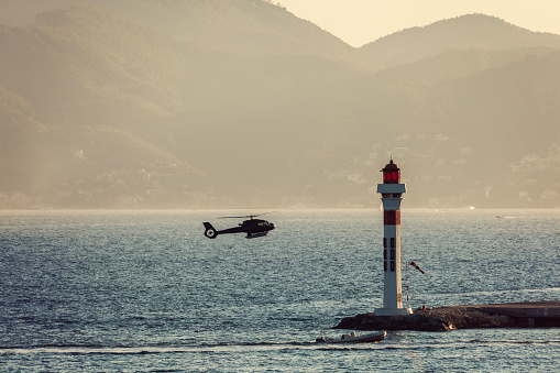 Lighthouse and landing helicopter in Cannes. Cannes, Provence-Alpes-Cote d'Azur, France