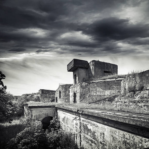 istock Old bunker from WWII period. Monochrome photo 520624123