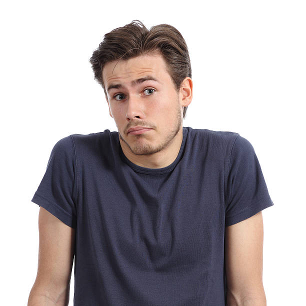 istock Front portrait of a young man doubting shrugging shoulders 520624405