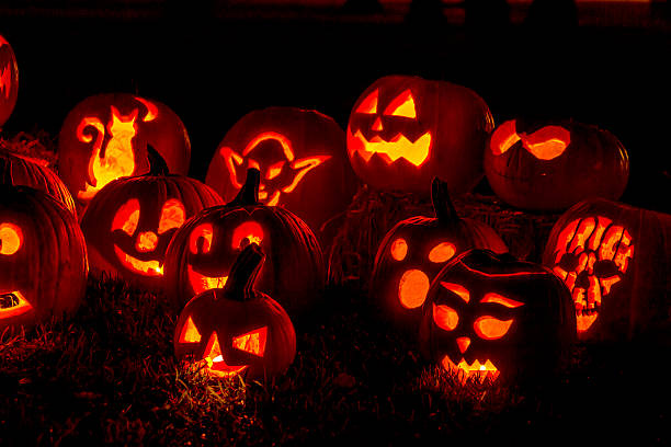 istock Lighted Halloween Pumpkins with Candles 520624433