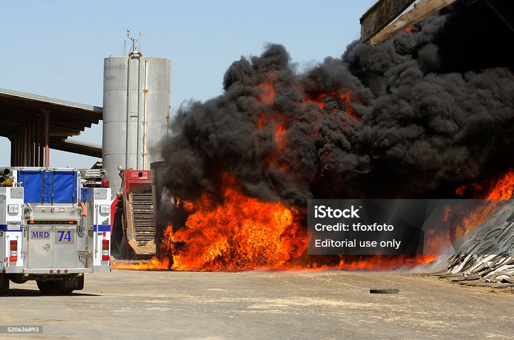 Dairy Farm Gustine, CA, USA - June 18, 2014: Fire fighters respond to a semi truck and silage fire at a dairy farm in Gustine, CA, on June 18, 2014 Accidents and Disasters Stock Photo