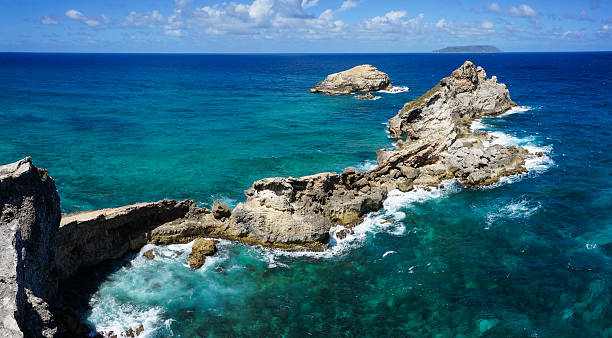 Pointe des Châteaux in Guadeloupe Pointe des Châteaux - Castles Headland & Ile La Désirade, Saint-François, Guadeloupe, France headland stock pictures, royalty-free photos & images