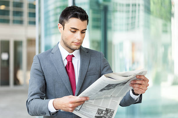istock Business man reading a newspaper 520638937