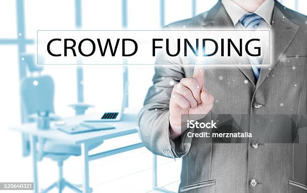 Businessman Pushes Virtual Crowd Funding Button Stock Photo - Download Image Now - Adult, Business, Business Finance and Industry