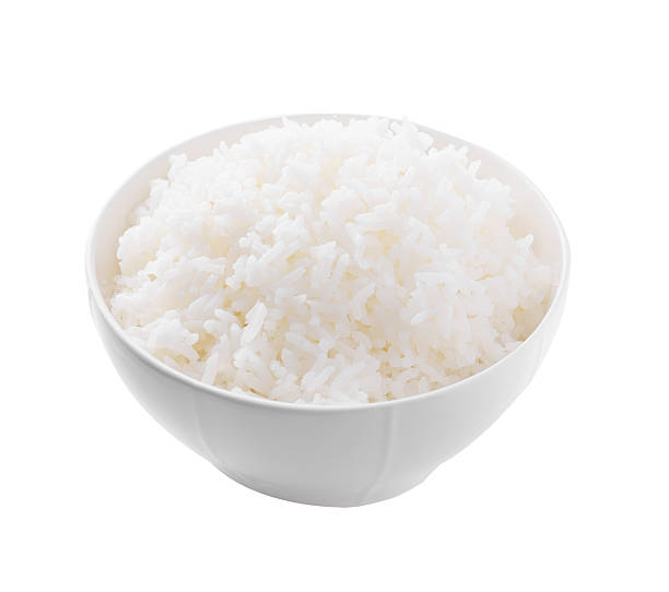 istock bowl full of rice on white Background 520640335
