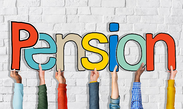 istock Diverse People's Hands Holding Word Pension 520640399