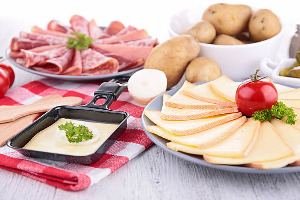 istock raclette cheese and meats 520640523
