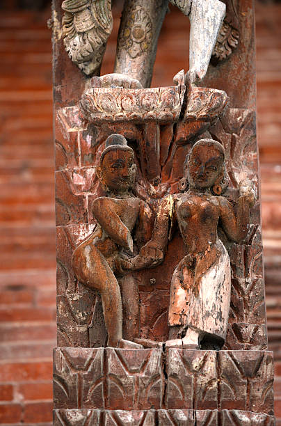 Erotic carving on a Hindu temple in Nepal Erotic carving, explicit Kama Sutra position on a Nepalese temple in Patan, Kathmandu, Nepal lingam yoni stock pictures, royalty-free photos & images
