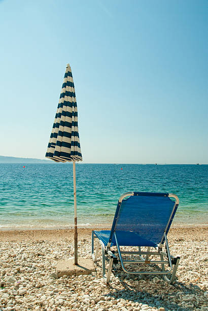 istock Sunbeds and umbrella on the beach 520641905