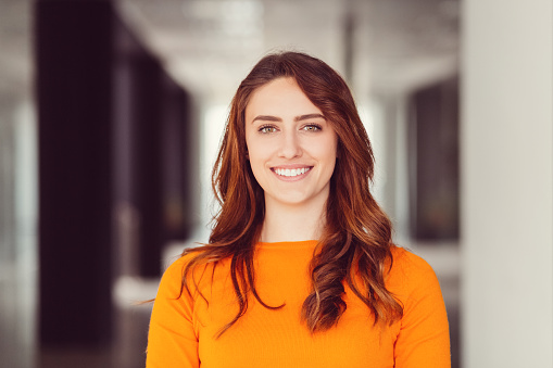 Portrait of happy woman smiling to the camera