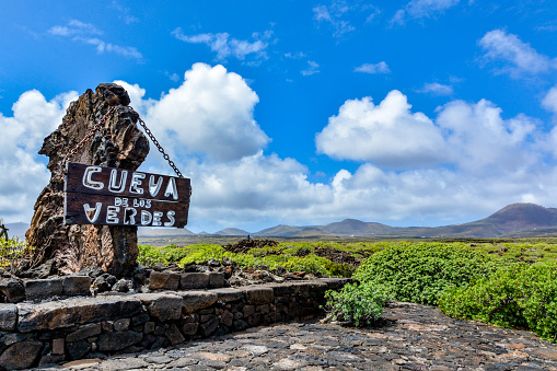 Entrance sign in front of Cueva de los Verdes, an amazing lava tube and tourist attraction on Lanzarote island, Spain