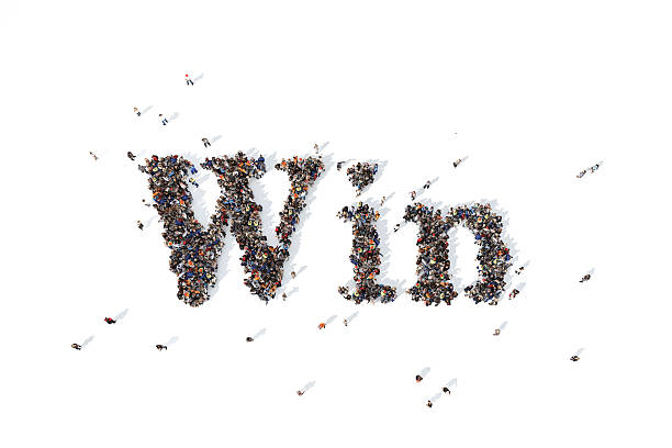 istock Group of people forming the word win 520647370