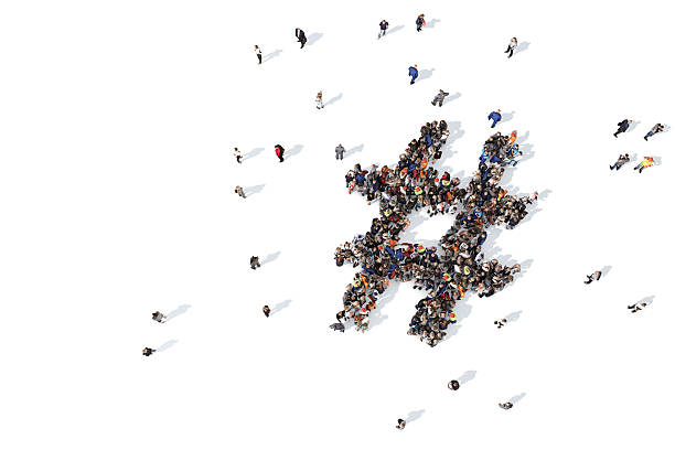 istock Group of people forming a hashtag symbol 520648246