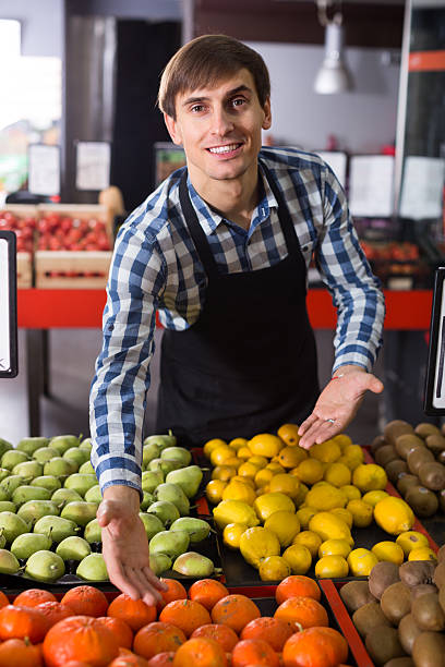 istock young man offering fruits 520648624