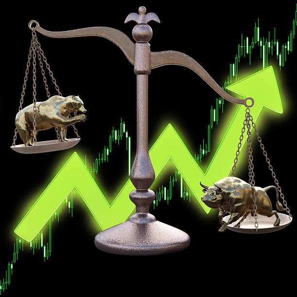 istock bear and bull on the scales 520648952