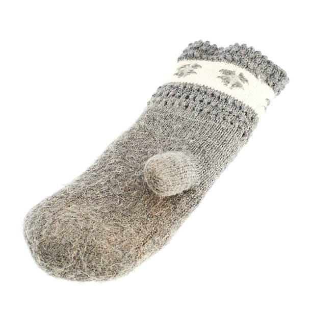 istock Old gray frayed mitten isolated 520649484