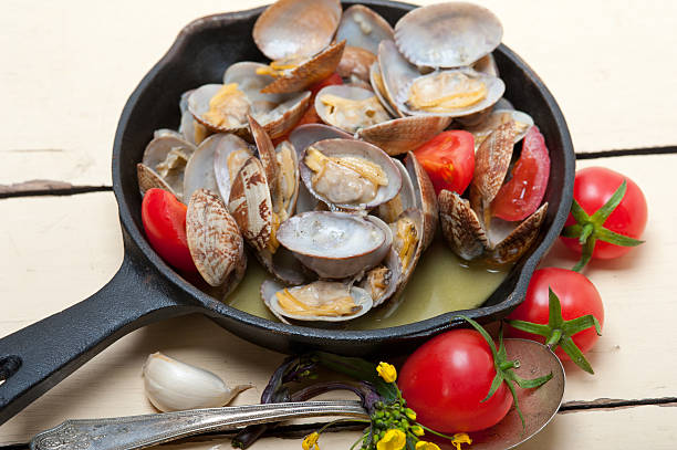 istock fresh clams on an iron skillet 520651782