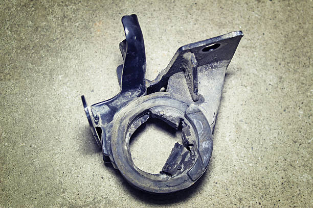 The damaged engine mount on a gray background stock photo