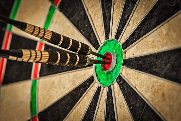istock Three darts in bull's eye close up 520657943