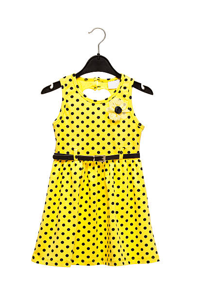 Yellow  dress on hanger isolated on white background