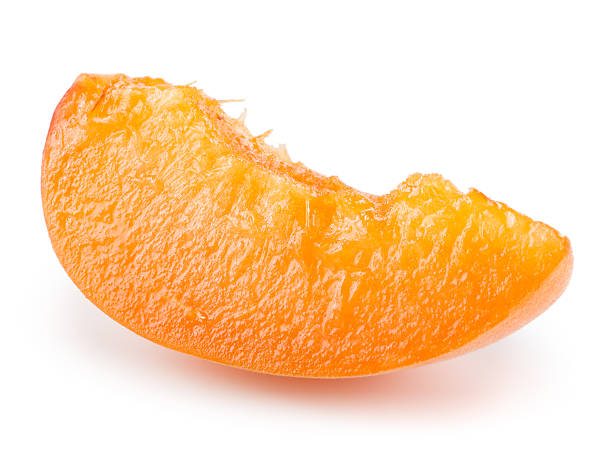 istock Slice of apricot isolated on white background 520658631