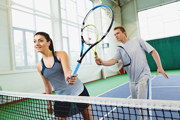 istock Low angle view of determined young man and woman playing 520658906