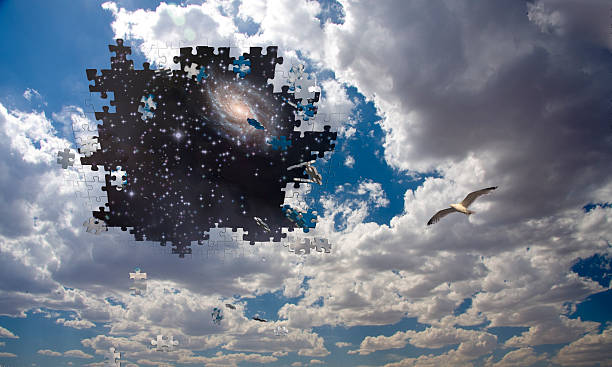 istock Puzzle piece daytime sky reveals night sky 520659181