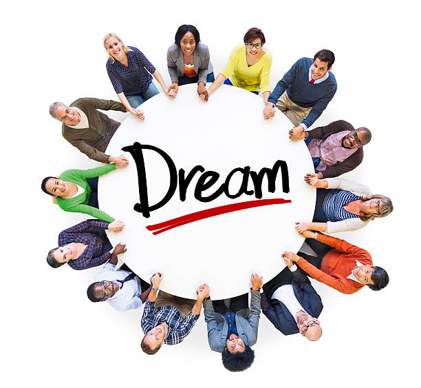 istock Group of People Holding Hands Around the Word Dream 520659853