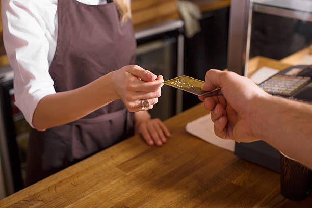 istock Man paying with credit card in the shop 520660910