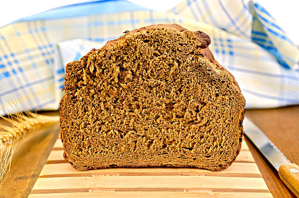 istock Rye homemade bread on a wooden stand 520661235