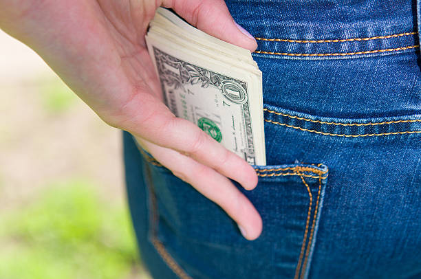 istock money in pocket 520661918