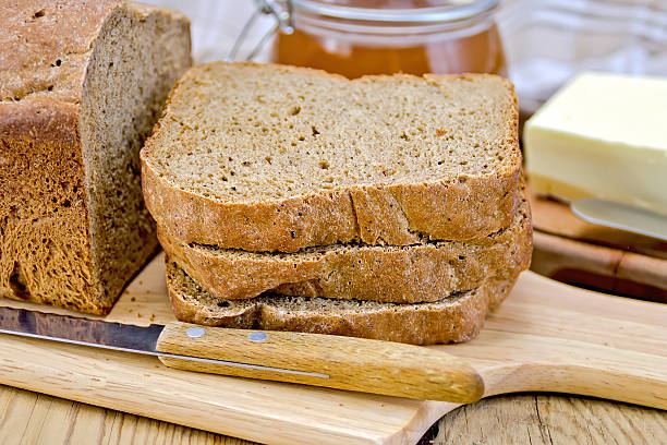 istock Rye homemade bread stacked with honey and knife 520662417