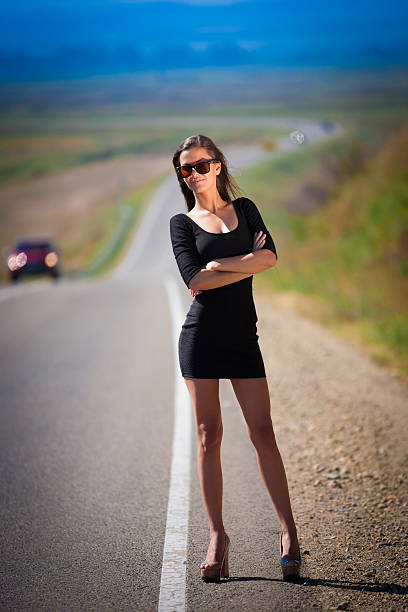 istock brunette woman road 520664633