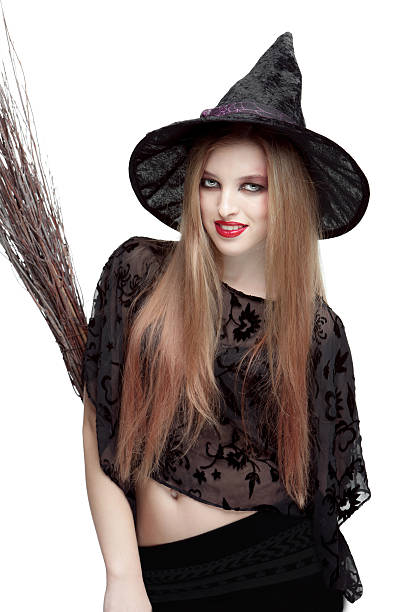 istock Girl in witch costume with a broom 520665743