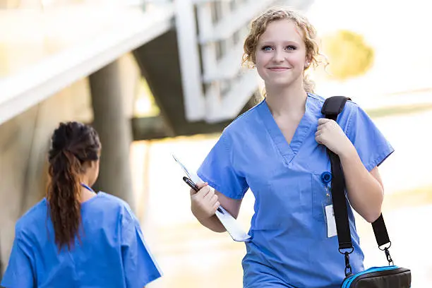 Nursing or medical students walking to class on college campus