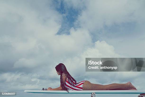 Tattooed Female Laying On Diving Board Stock Photo - Download Image Now - Brown Hair, Concrete, Diving Board