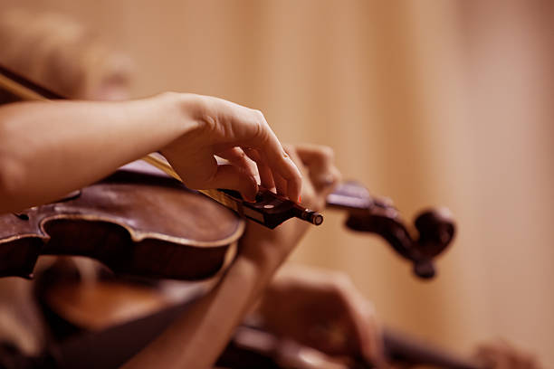 istock Hands girl playing the violin 520687619