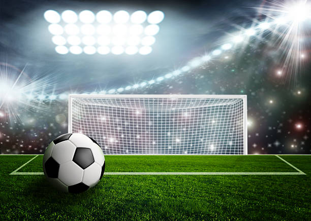 istock Soccer ball on green stadium arena 520687679
