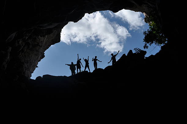 Cave in Brazil People having fun in a cave in Chapada Diamantina, one of the most beautiful places in Bahia state, Brazil unknown gender stock pictures, royalty-free photos & images