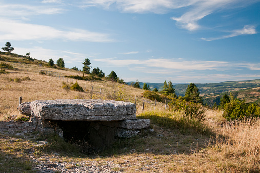 Rural landscape : field and dolmen in the foreground