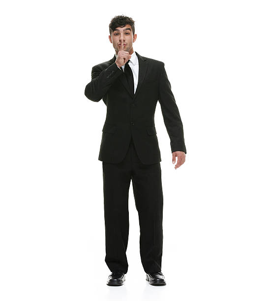 istock Businessman showing keep quiet sign 520700188