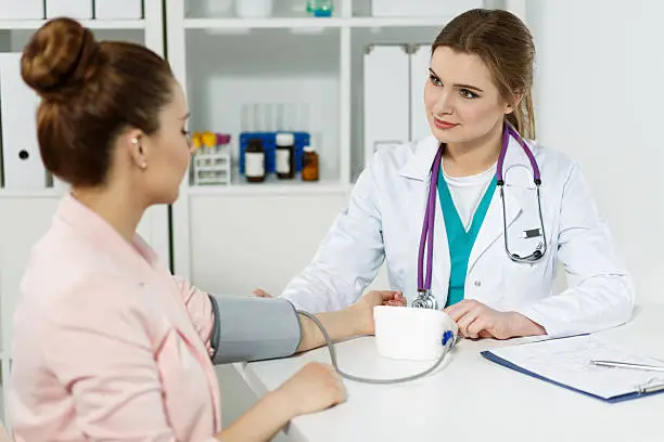 Photo of Smiling cheerful female medicine doctor with pretty face