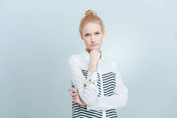 istock Pensive casual woman looking at camera 520701354