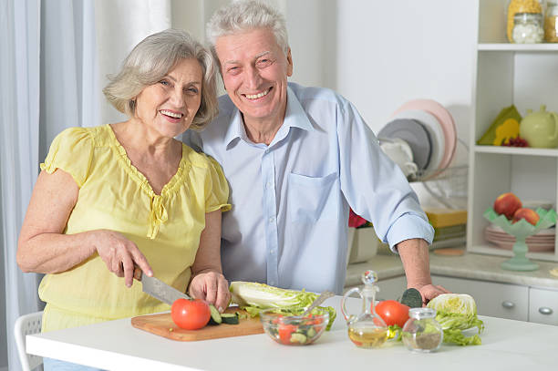 istock senior man and woman  in the kitchen 520701588