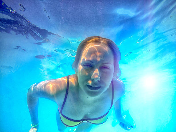 istock girl dive in the deep pool 520701770