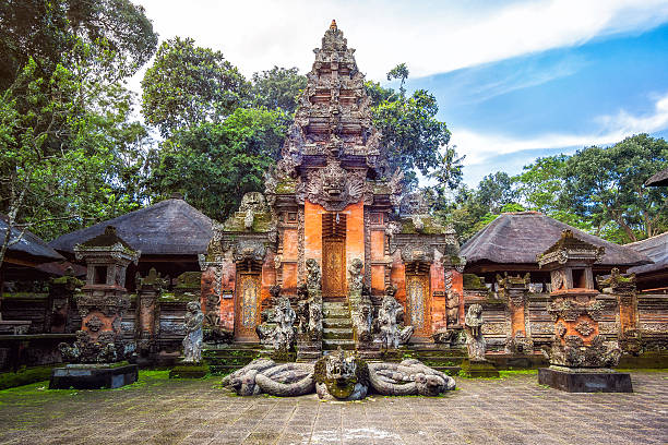 Temple at Monkey Forest Sanctuary in Ubud, Bali, Indonesia. Hindu temple at Monkey Forest Sanctuary in Ubud, Bali, Indonesia. balinese mythological demon statue in ubud bali indonesia stock pictures, royalty-free photos & images